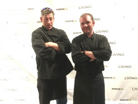 cater waiters posing on step and repeat
