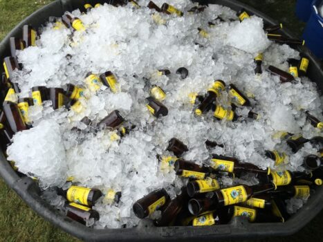 a variety of beers in an ice bucket